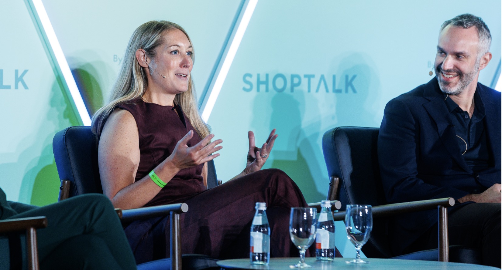 A person in a purple dress talking to a person AI-generated content may be incorrect.